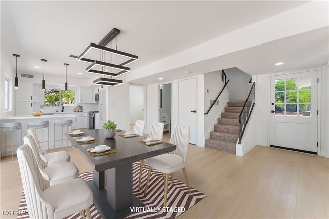 Dining area with light wood-style floors, stairs, and recessed lighting | Image 5