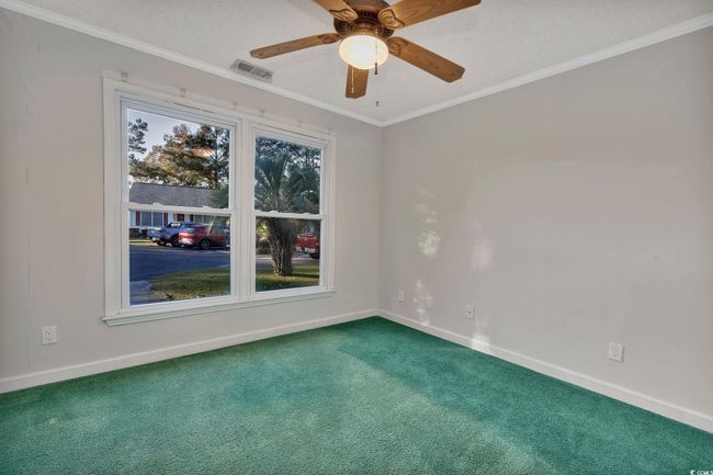 Bathroom with vanity, crown molding, toilet, a textured ceiling, and walk in shower | Image 13