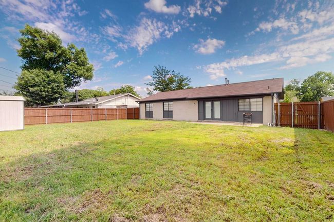 Back of property featuring a fenced backyard, a patio, and french doors | Image 29