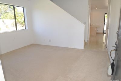 Living room as you enter through the front door. | Image 2