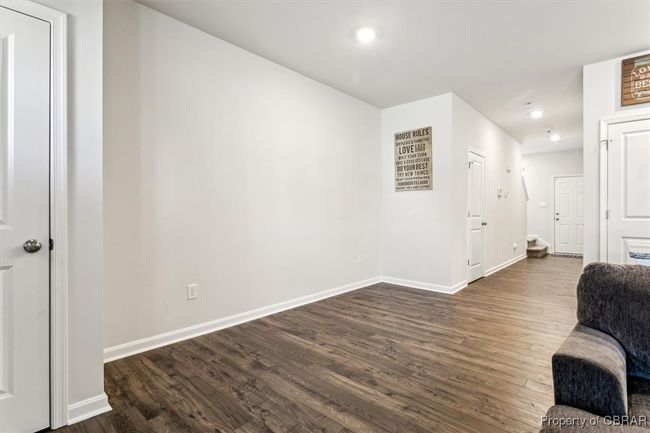 Living area with recessed lighting, baseboards, and dark wood-style floors | Image 8