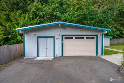 Detached garage located within the gated back yard with nice shop attached | Image 3