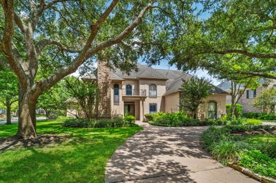 Phenomenal upscale living in this French-style, stone & stucco home located in exclusive SWEETWATER neighborhood. | Image 1