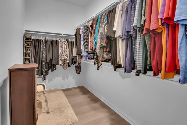 Spacious closet featuring wood finished floors | Image 18