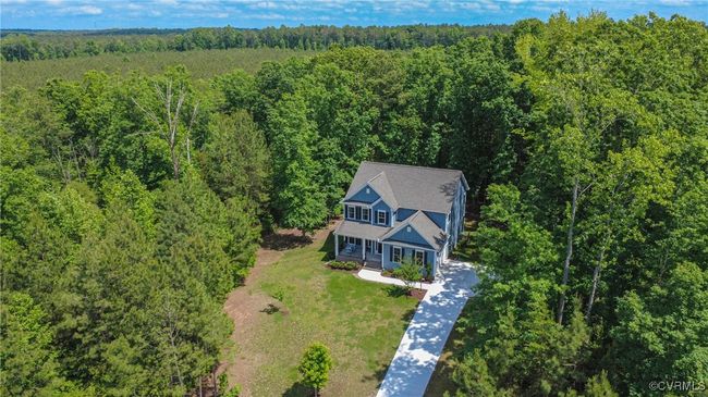 Aerial view showing wooded privacy and cul-de-sac location. | Image 36