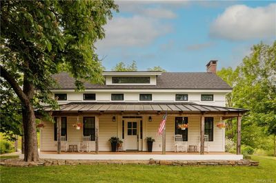 View of front facade with a front lawn and a porch | Image 3