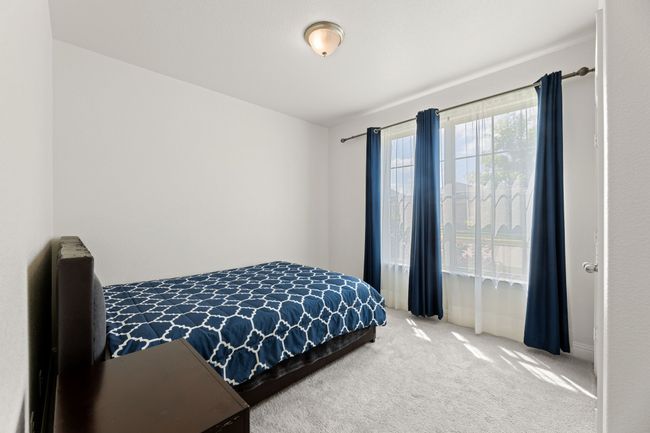 Second bedroom downstairs with adjacent bathroom | Image 6