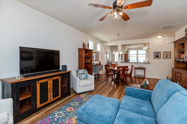 great room featuring a ceiling fan | Image 13