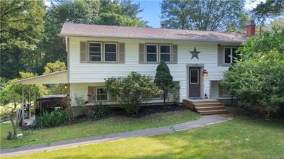 Raised ranch featuring a front lawn | Image 2