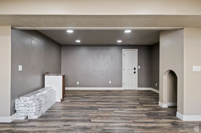 Interior space with dark wood-type flooring, recessed lighting, and baseboards | Image 30