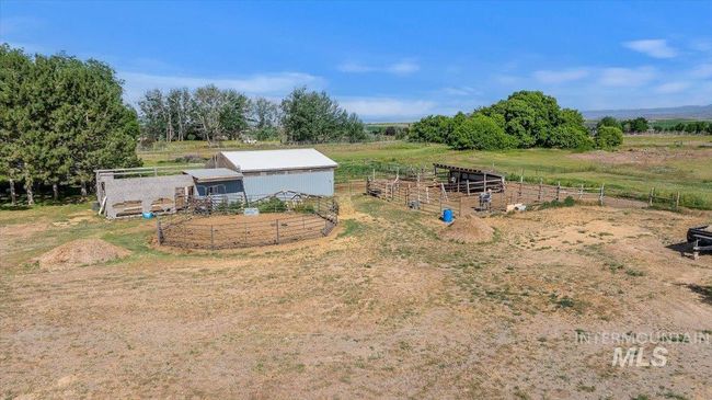 View of yard featuring an exterior structure, a view of rural / pastoral area, and an outdoor structure | Image 45