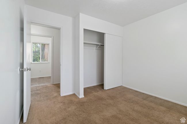 Unfurnished bedroom featuring carpet and a closet | Image 19