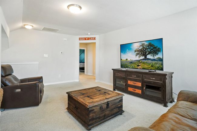 Living area featuring carpet, vaulted ceiling, and baseboards | Image 19