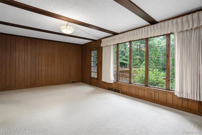 Family room with wall of windows bringing outdoors in | Image 13