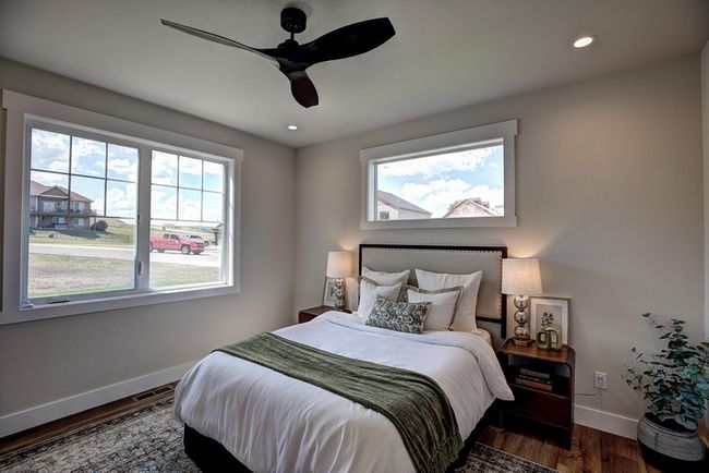 Bedroom featuring multiple windows, ceiling fan, dark wood-style flooring, and recessed lighting | Image 22