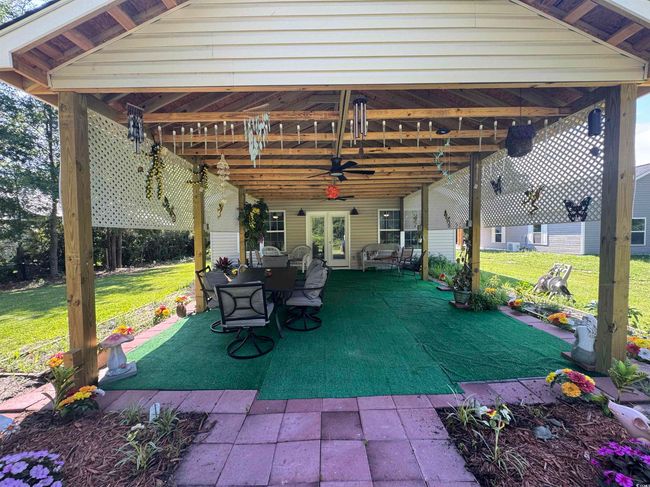 View of patio / terrace featuring ceiling fan, french doors, and outdoor dining area | Image 19