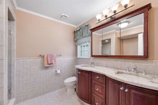 Updated primary bathroom with double vanity, separate tub and shower | Image 20
