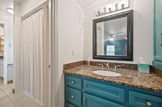 Secondary bathroom - split vanities and shower/tub combo. | Image 24