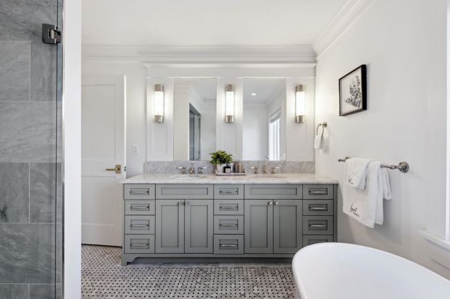 Full bathroom with a freestanding bath, a sink, double vanity, and crown molding | Image 14