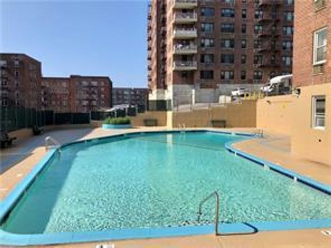 Community pool featuring a city view | Image 11