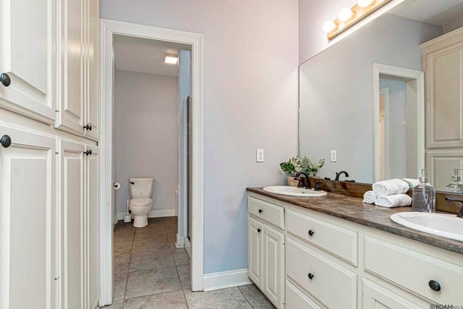 This is the shared bathroom with 2 separate sinks, one of which has a vanity. Equipped with Separate shower and tub. Second Floor. | Image 29