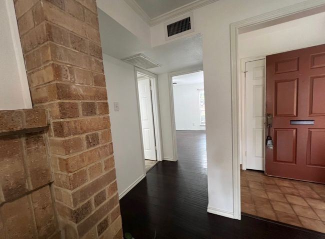 Entrance foyer with visible vents, baseboards, and ornamental molding | Image 8