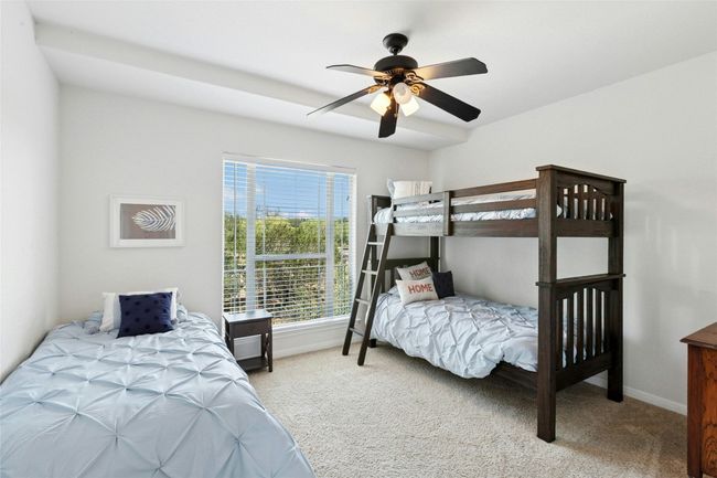Bedroom featuring carpet floors and ceiling fan | Image 24