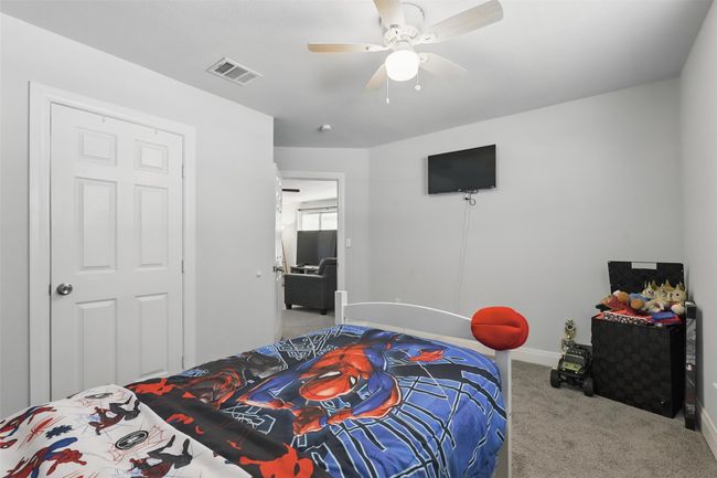 Bedroom with carpet floors, baseboards, and a ceiling fan | Image 20