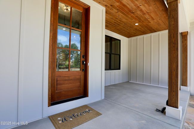 Gorgeous front entrance wood accents - door, ceiling & columns! | Image 4