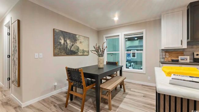 Dining room with light wood finished floors and baseboards | Image 17