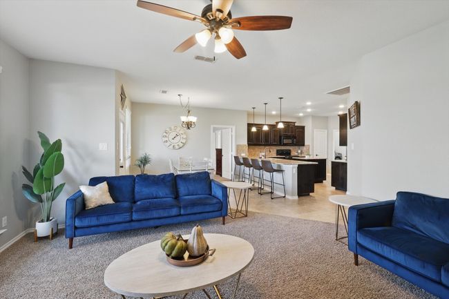 Living area with recessed lighting, visible vents, light colored carpet, and a ceiling fan | Image 15