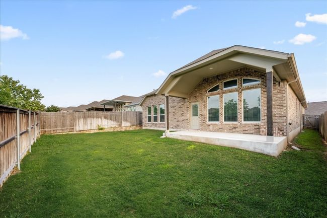 Rear view of property featuring brick siding and a patio | Image 34