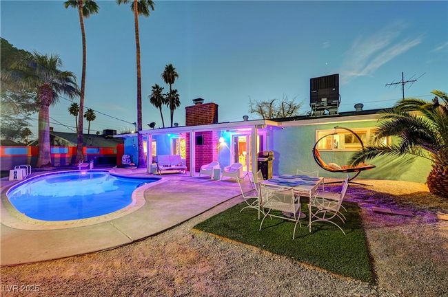 Outdoor pool featuring a patio area and central AC unit | Image 40