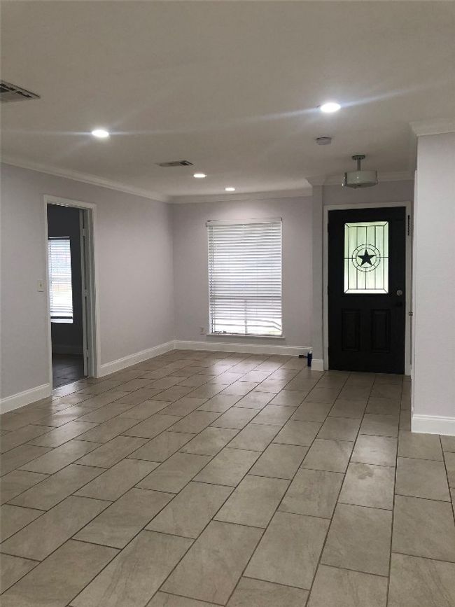 Entryway featuring ornamental molding, light tile patterned floors, and recessed lighting | Image 10