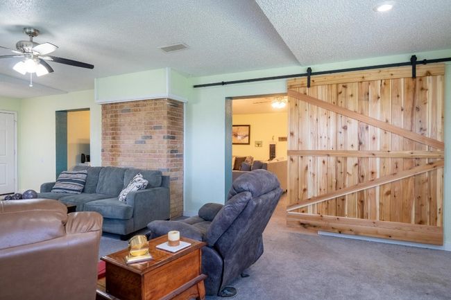 Second living area is separated by custom barn doors! | Image 22