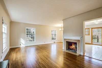 Newly refinished natural hardwood floors - maintained the original charm and elegance. | Image 2