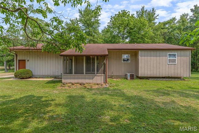View of front of house featuring a front yard and a sunroom | Image 7