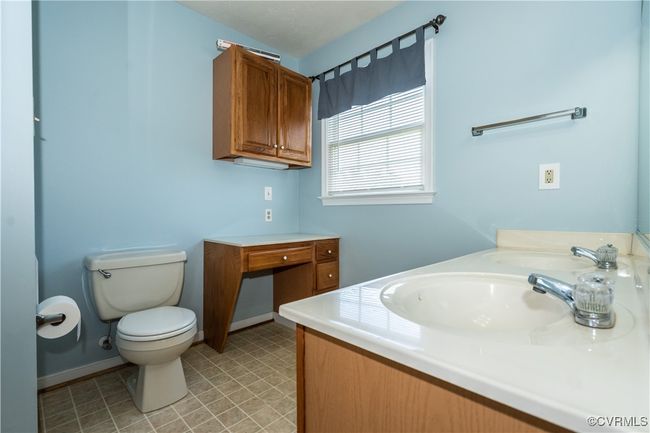 Bathroom featuring vanity and toilet | Image 13