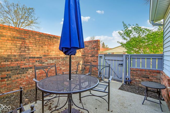 view of patio / terrace with fence, a gate, and outdoor dining space | Image 21