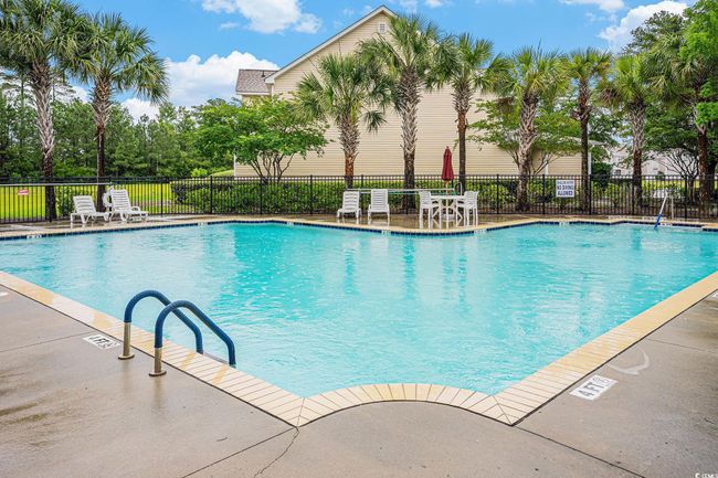 Community pool with a patio area | Image 27