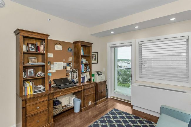 Home office featuring dark wood-style flooring | Image 18