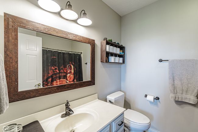 full bath in the basement featuring toilet and vanity | Image 35