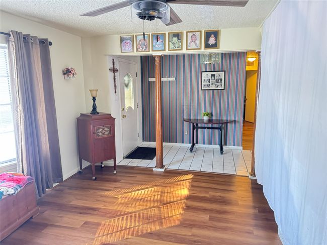 Foyer entrance with ceiling fan, hardwood / wood-style floors, and a textured ceiling | Image 7