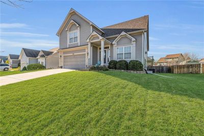 View of front of house with a garage and a front yard | Image 3