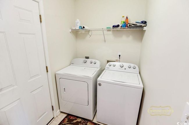 Laundry area featuring independent washer and dryer | Image 26