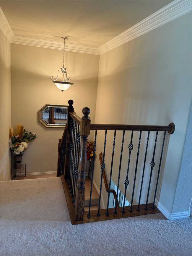 Stairs featuring carpet flooring, ornamental molding, and baseboards | Image 28