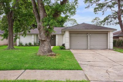 Welcome to this delightful brick home, where classic charm meets modern appeal. House has had BRAND NEW ROOF installed since photo was taken! | Image 1