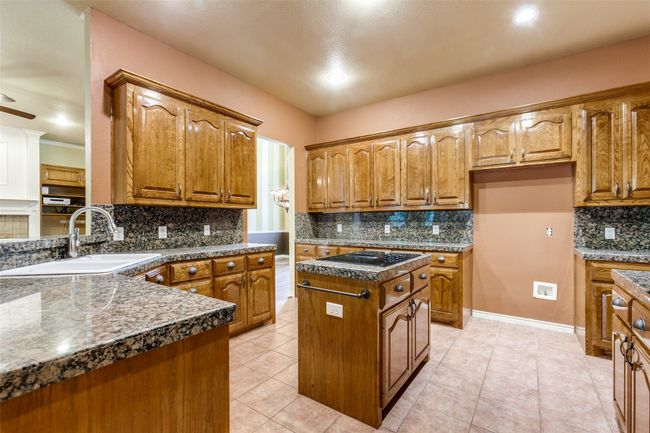 Granite countersops and lots of storage. | Image 13