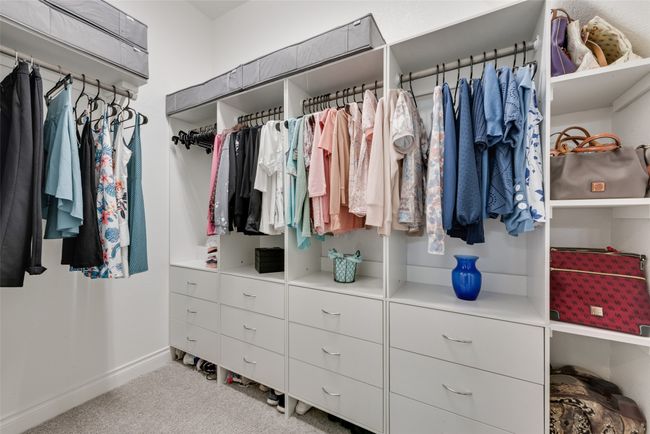 The primary suite offers 2 walk-in closets with custom closet systems! | Image 18