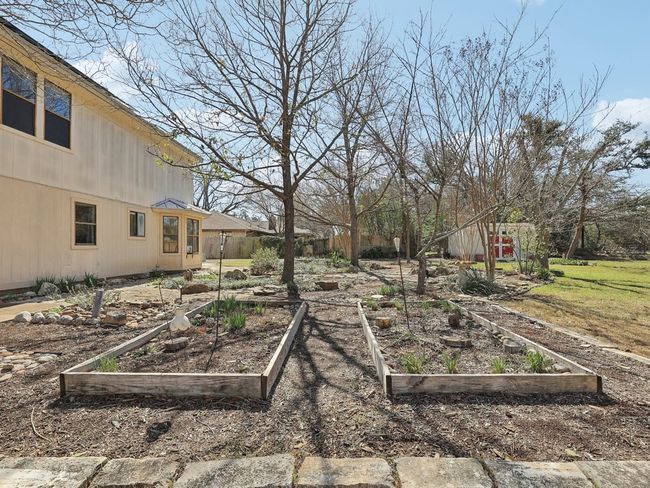 View of yard with a garden and fence | Image 30